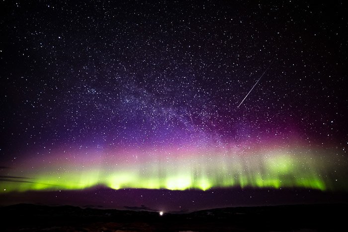 Milky Way photography showing a shooting star 