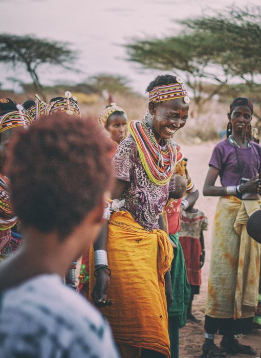A documentary image of smiling tribal woman from Africa